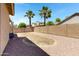 Large backyard with low maintenance gravel and block wall fence at 43860 W Roth Rd, Maricopa, AZ 85138