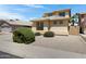 Charming two-story home featuring desert landscaping, neutral colors, and a well-maintained exterior at 43860 W Roth Rd, Maricopa, AZ 85138