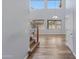 Bright foyer showcasing hardwood floors, a staircase, and large windows providing ample natural light at 43860 W Roth Rd, Maricopa, AZ 85138