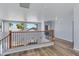 Spacious loft area with wood floors and views of palm trees at 43860 W Roth Rd, Maricopa, AZ 85138