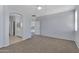 Spacious main bedroom with neutral carpet and ensuite bathroom with a walk-in closet at 43860 W Roth Rd, Maricopa, AZ 85138