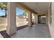 Covered patio with ceiling fan overlooking the low maintenance backyard at 43860 W Roth Rd, Maricopa, AZ 85138