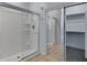 Tile shower with glass door and chrome fixtures alongside a sliding-door mirrored closet at 43860 W Roth Rd, Maricopa, AZ 85138