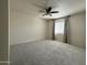 Cozy bedroom with soft carpet, neutral walls and a ceiling fan at 4444 E Paradise Village N Pkwy # 251, Phoenix, AZ 85032