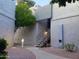 Charming building exterior with walkway, blue stair railing and desert landscaping at 4444 E Paradise Village N Pkwy # 251, Phoenix, AZ 85032