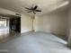 Spacious living room featuring plush carpet and ceiling fan at 4444 E Paradise Village N Pkwy # 251, Phoenix, AZ 85032