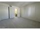 Bright bedroom with plush carpeting, closet and en-suite bathroom access at 4444 E Paradise Village N Pkwy # 252, Phoenix, AZ 85032