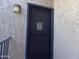 Front door of unit with blue trim and a security screen at 4444 E Paradise Village N Pkwy # 252, Phoenix, AZ 85032