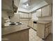 Bright kitchen with wooden cabinets, updated appliances, and ample countertop space at 4444 E Paradise Village N Pkwy # 252, Phoenix, AZ 85032