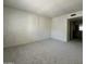 Large living room area showcasing neutral colors and carpet flooring at 4444 E Paradise Village N Pkwy # 252, Phoenix, AZ 85032