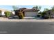 Charming home featuring a well-maintained front yard with desert landscaping and a two-car garage at 4613 E Walnut Rd, Gilbert, AZ 85298