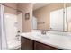 Bathroom featuring a vanity with dark wood cabinets, a bathtub with shower, and neutral paint at 4752 E Portola Valley Dr # 103, Gilbert, AZ 85297