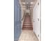 Welcoming entryway featuring stylish tile flooring and an ascending staircase at 4752 E Portola Valley Dr # 103, Gilbert, AZ 85297