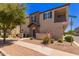 Attractive townhome with a stone facade and balcony, set on a corner lot at 4752 E Portola Valley Dr # 103, Gilbert, AZ 85297