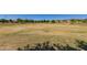 Expansive green space for leisure activities is surrounded by residential buildings at 4752 E Portola Valley Dr # 103, Gilbert, AZ 85297