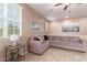 Well-lit living room with a comfortable sectional sofa and neutral decor at 4752 E Portola Valley Dr # 103, Gilbert, AZ 85297