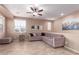 Spacious living room featuring a plush sectional sofa and tile floors at 4752 E Portola Valley Dr # 103, Gilbert, AZ 85297