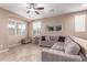 Comfortable living room featuring a large sectional sofa and ample natural light at 4752 E Portola Valley Dr # 103, Gilbert, AZ 85297