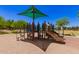 A neighborhood playground offers a multi-level play structure and a sun shade at 4752 E Portola Valley Dr # 103, Gilbert, AZ 85297