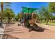 A neighborhood playground features a fun, colorful jungle gym, shaded from the sun at 4752 E Portola Valley Dr # 103, Gilbert, AZ 85297