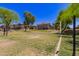 Outdoor volleyball court with surrounding landscaping and buildings in the background at 4752 E Portola Valley Dr # 103, Gilbert, AZ 85297