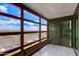 Enclosed balcony with city views, tile flooring, and planter boxes for a relaxing outdoor space at 4808 N 24Th St # 806, Phoenix, AZ 85016