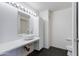 Minimalist bathroom with a modern vessel sink, vanity lighting, and sleek black tile flooring at 4808 N 24Th St # 806, Phoenix, AZ 85016