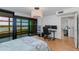 Cozy bedroom with a balcony offering city views and a well-equipped workspace area at 4808 N 24Th St # 806, Phoenix, AZ 85016