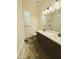Bathroom featuring double sinks, a shower, and a toilet at 5304 S Wesley S Cir, Mesa, AZ 85212