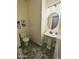 Small bathroom featuring stone-look flooring and a pedestal sink at 5304 S Wesley S Cir, Mesa, AZ 85212