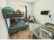 bedroom with bunkbeds, TV, and lots of books at 5304 S Wesley S Cir, Mesa, AZ 85212