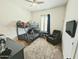 Well-lit bedroom featuring bunkbeds, TV, and chair at 5304 S Wesley S Cir, Mesa, AZ 85212