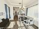 Inviting dining area is open to the kitchen and features modern décor at 5304 S Wesley S Cir, Mesa, AZ 85212
