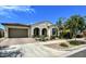 Charming single-story home featuring a tile roof, arched entryway, and well-maintained front yard landscaping at 5304 S Wesley S Cir, Mesa, AZ 85212