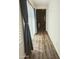 Hallway featuring wood floors, bright natural light, and stylish neutral paint scheme at 5304 S Wesley S Cir, Mesa, AZ 85212