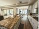 Bright kitchen with granite countertops and views into the dining and living spaces, promoting seamless entertaining at 5304 S Wesley S Cir, Mesa, AZ 85212
