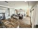 An expansive kitchen seamlessly transitions to a luxurious living room, boasting high-end features and ample space at 5304 S Wesley S Cir, Mesa, AZ 85212