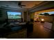 Comfortable living room with large screen and patio with fire pit at 5304 S Wesley S Cir, Mesa, AZ 85212