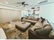 Open-concept living room with comfortable seating, a view of the modern kitchen, and ample natural light at 5304 S Wesley S Cir, Mesa, AZ 85212