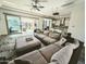 Comfortable living room with a large couch, direct access to the backyard and kitchen at 5304 S Wesley S Cir, Mesa, AZ 85212
