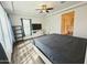View of the bedroom featuring wood floors, light and dark furnishings and plenty of natural light at 5304 S Wesley S Cir, Mesa, AZ 85212