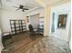 Home office area with neutral tones, desk, shelving, and a comfortable chair for a productive workspace at 5304 S Wesley S Cir, Mesa, AZ 85212