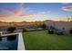 Spacious backyard featuring a pool with mountain views, lush turf, and relaxing seating at 537 E Balao Dr, Phoenix, AZ 85085