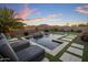 Resort-style backyard pool with water feature, mountain views, basketball hoop, and lounge seating at 537 E Balao Dr, Phoenix, AZ 85085