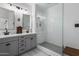 Stylish bathroom with double vanity, modern fixtures, and glass-enclosed shower at 537 E Balao Dr, Phoenix, AZ 85085