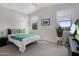 Bright bedroom with high ceilings, serene decor, and two windows for ample natural light at 537 E Balao Dr, Phoenix, AZ 85085