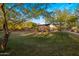 Scenic view of community park amenities, including a covered outdoor dining area and lush greenery at 537 E Balao Dr, Phoenix, AZ 85085