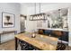 Dining area with a clear view of the modern kitchen and home entryway at 537 E Balao Dr, Phoenix, AZ 85085