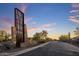 Community entrance featuring desert landscaping and architectural features at 537 E Balao Dr, Phoenix, AZ 85085
