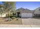 Charming single-story home featuring a three-car garage and manicured front yard at 537 E Balao Dr, Phoenix, AZ 85085